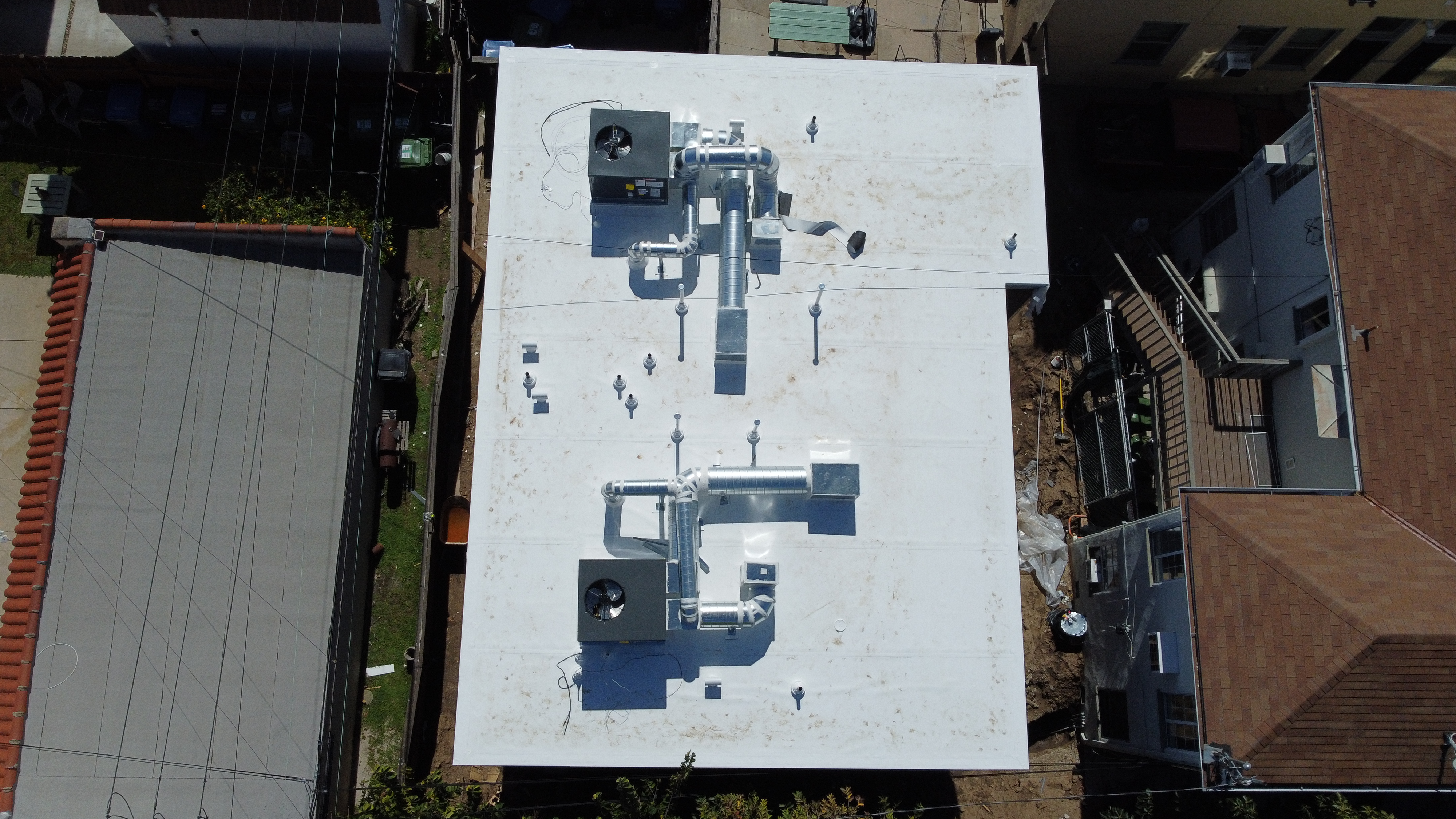 Aerial view of a completed rooftop solar project